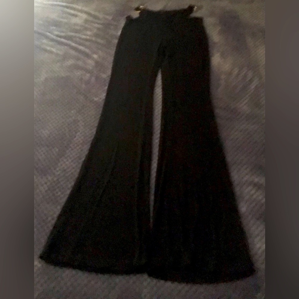 Boot cut leggings with cut outs on the side . Size xs , very stretchy .